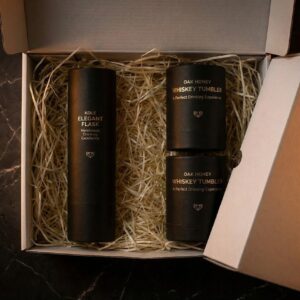 Close-up of Kole Flask and wooden whiskey cups showing natural oak grain and honey wax finish.